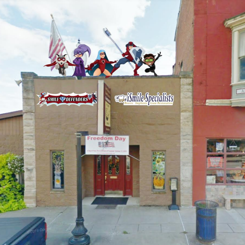 Picture of a dental office with the Smile Defender Characters on the Rooftop