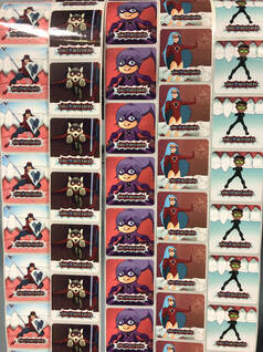 Picture of the smile defender stickers, showing all 5 designs.